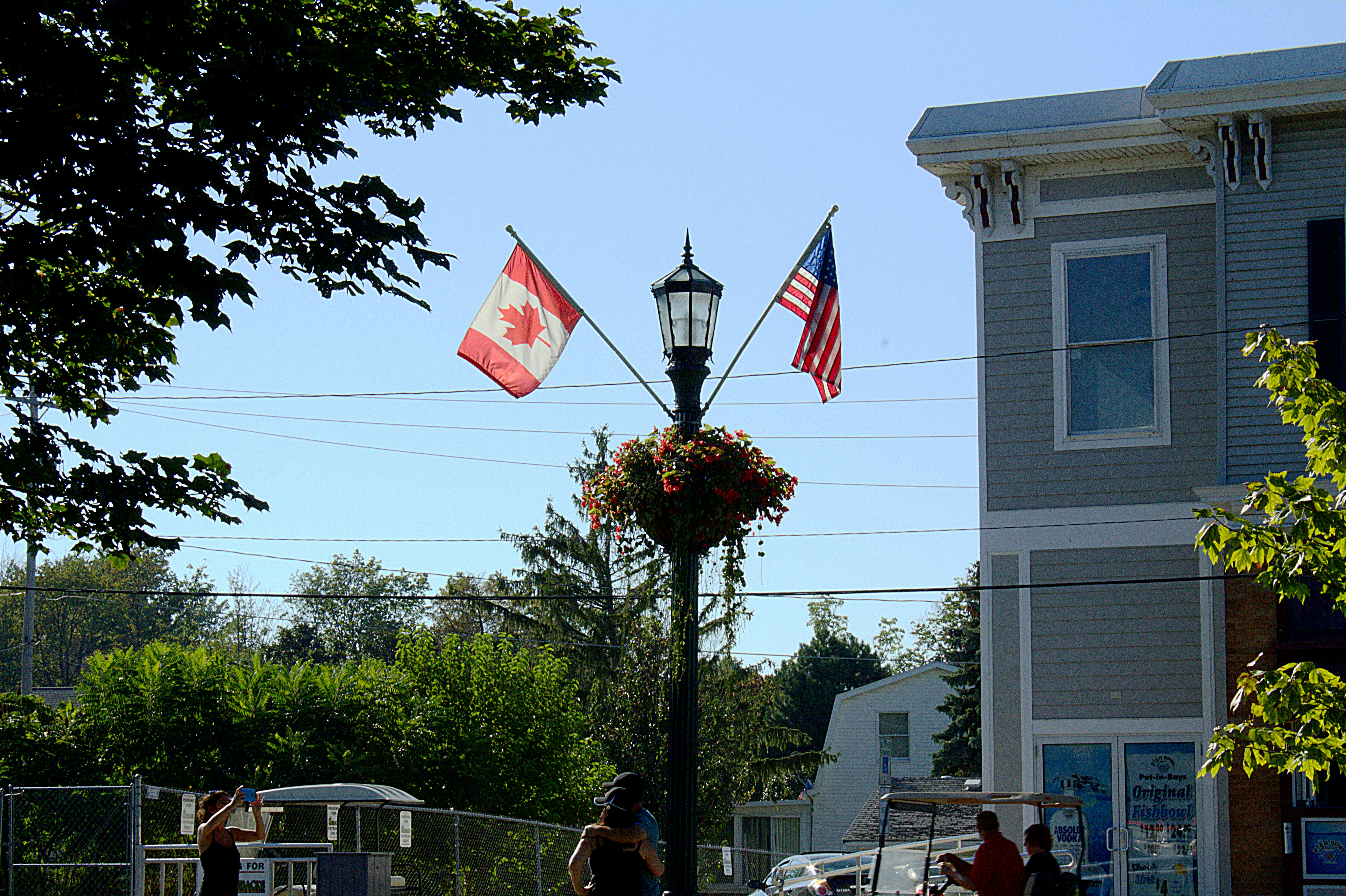 Canadian and American flags representing cross-border security perspectives